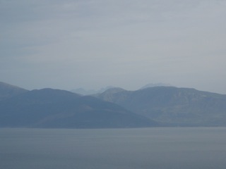 Grey sea, greyer mountains