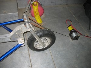 Winch at front wheel attachment point