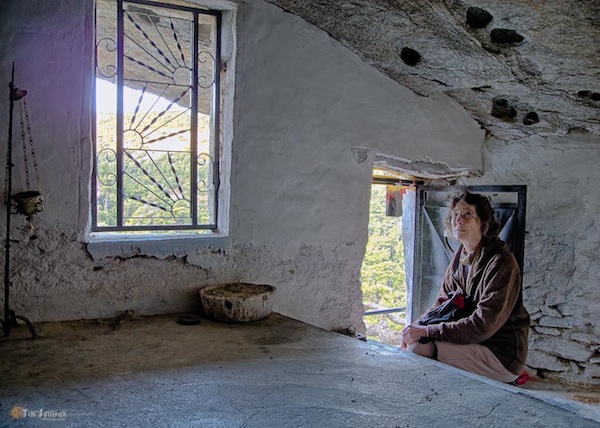 The author inside the tiny, “tree-house” chapel.