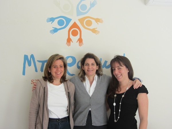 Tatiana Moulouli, Xenia Papastavrou, and Alexia Moatsou pose in front of the “Boroume” logo.