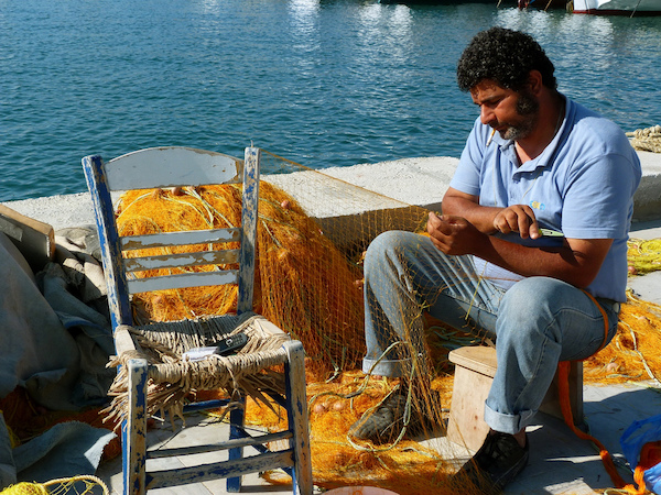 Mending and untangling Greek fishing net.