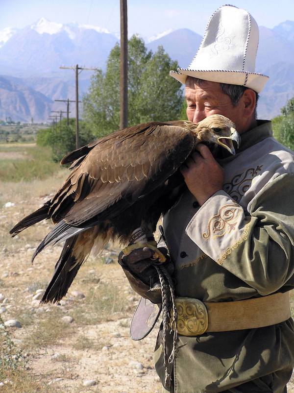 A traditional eagle hunter and his bird.