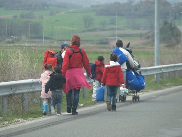 Refugee family walking Hwy A1 toward Idomeni.