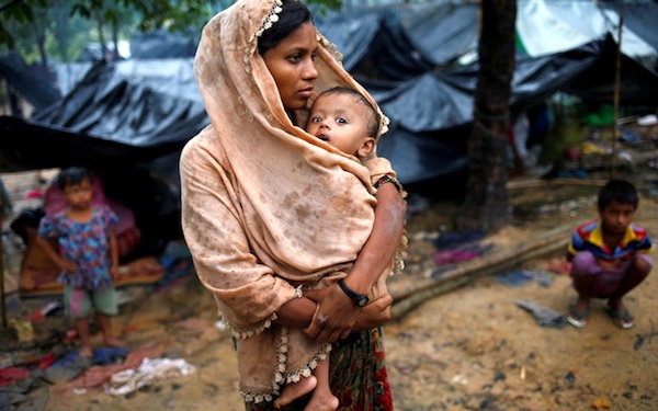 On Bangladesh’s border, Rohingya woman and her baby. (Photo: Reuters[https://curious.com/curios/14290#date].)