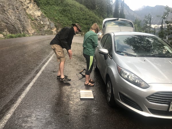 Teaching how to change a tire.