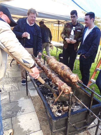 Roasting lamb on a spit at Easter.