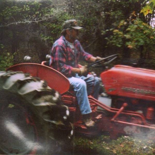 Ray White, atop one of his International Harvester tractors.