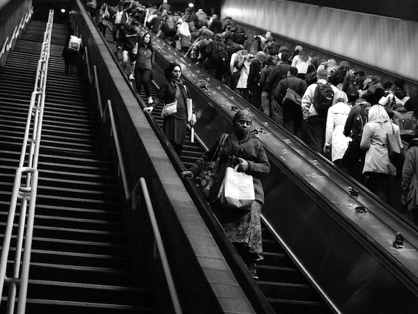 Commuters riding the escalators during the evening commute at a T station in Cambridge, Massachusetts. (Photo: Cassandra Zampini.)