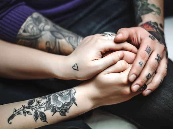 Love is the answer. (Image via SelfTattoo.)