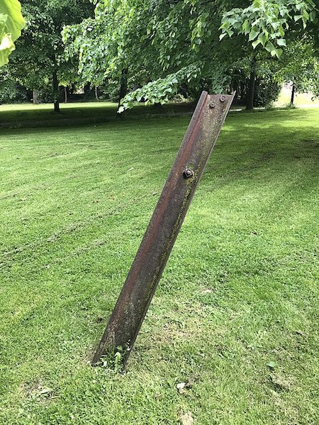 “. . . a tram rail hurled aloft by a German bomb . . .”