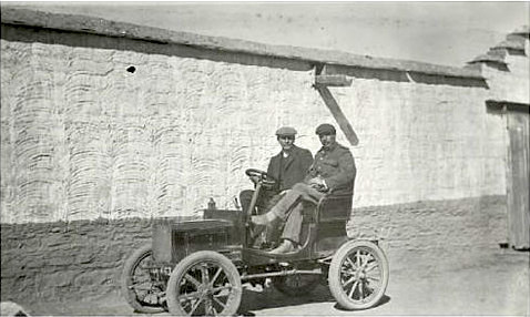 Frederick O'Connor and Thubten Chokyi Nyima, 9th Panchen Lama, in a Peugeot car