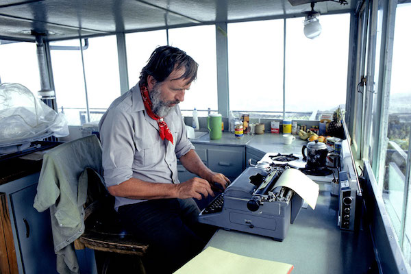 Edward Abbey in a US Forest Service fire tower on Aztec Peak in Arizona. (Photo by Buddy Mays|Alamy Stock Photo.)