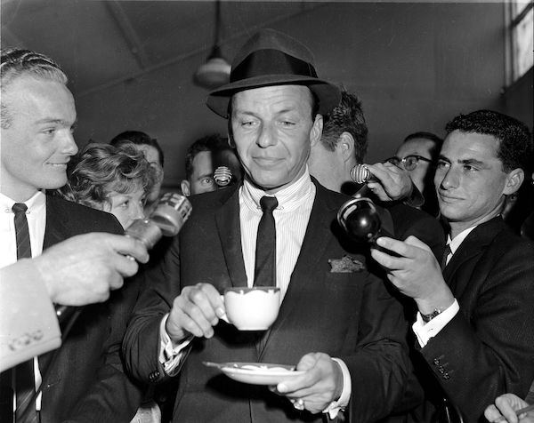 Sinatra drinking coffee upon arrival in Sydney, Australia in 1961.