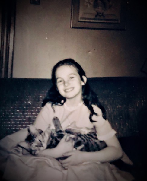 The author with her cat, “Happy,” c. 1961.