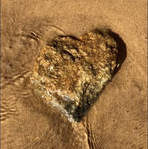 Heart-stone in the sea off Aghios Sostis Beach.