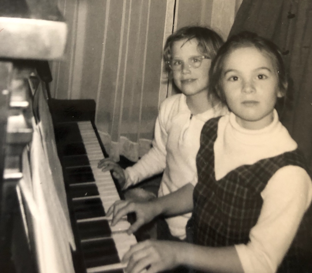 Duets with a neighborhood friend, c. 1961.