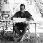 Patrick Leigh Fermor writing in his garden at Kardamyli, Greece. (Photo: Estate of Patrick Leigh Fermor.)