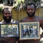 Tanna islanders with photos of Prince Philip. (Photo: Christopher Hogue Thompson.) A haint-blue porch ceiling.