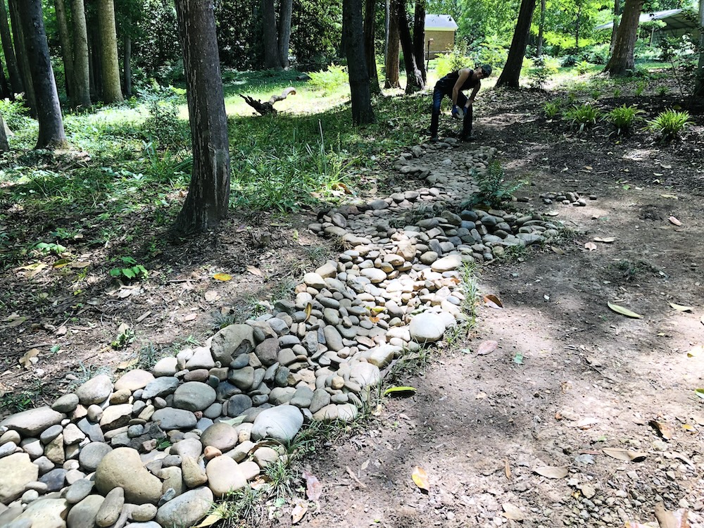 Stone by stone, wheelbarrow by wheelbarrow. (Photo: E. Boleman-Herring.)