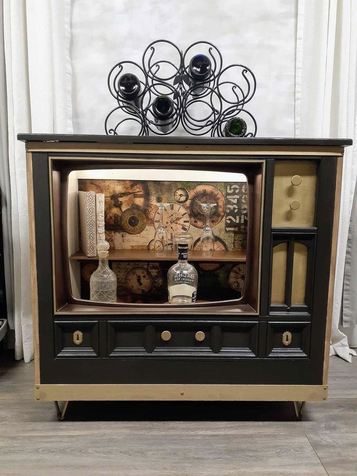 Cabinet, $300, Buford GA, Built new cabinet for this VINTAGE TV FACE. Remote control/motion sensor lights inside. Great for coffee/snack bar, tv stand, beverage center, bookcase, pet bed, etc. Has removable shelf for added deep storage. Painted in Coffee Bean w/gold accents. Black metal legs. Beautiful decoupage paper of old clocks completes this piece. Incudes metal bottle rack and 3 wood/metal risers. 34.25 X 36 X 21.25, $300.00 cash, Local delivery available.