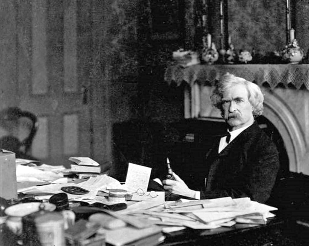 Mark Twain at his desk.